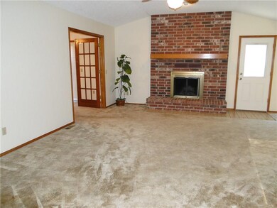Large Family room with an eye catching fireplace.