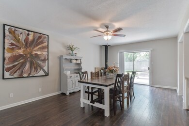 Beautiful dining area includes a charming vintage wood-burning fireplace.