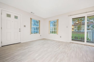 Entryway featuring light wood-style floors and baseboards