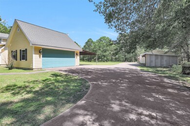 THE DETACHED 2 CAR GARAGE HAS AN ATTACHED 2 CAR CARPORT AND HAS A COVERED ENTRY FROM THE HOME. PLENTY OF ATTIC SPACE IN THE GARAGE AS WELL.