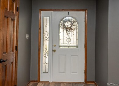 Entrance foyer featuring LVP wood-style floors