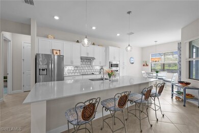 Kitchen with a sink, stainless steel appliances, v