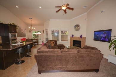 Family Room features decorative crown molding, ove