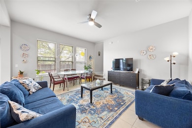 Living room with light tile patterned floors, cei