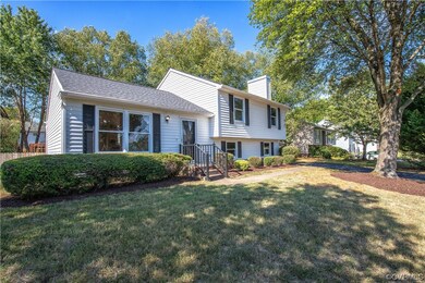 Split level home featuring a front lawn