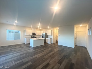 Living room with recessed lighting and luxury vinyl plank floors