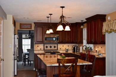 Large working kitchen with granite counter top and