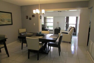 Dining room looking into enclosed patio