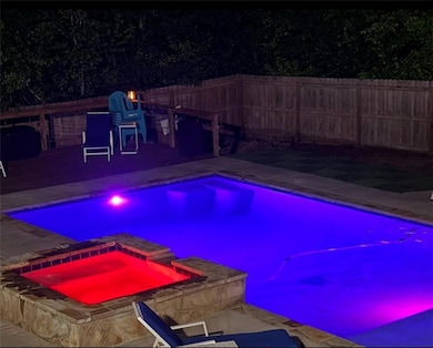 View of swimming pool featuring a fenced backyard 
