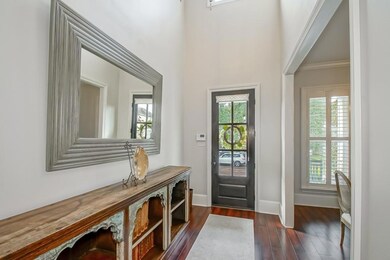 Beautiful foyer with high ceilings, engineered woo