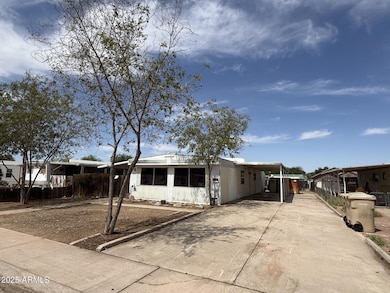 FRONT + CARPORT VIEW
