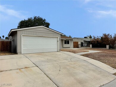 Ranch-style house with fence, concrete driveway, a