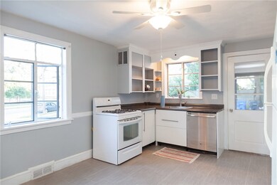 Beautiful sunlight flood this lovely kitchen with