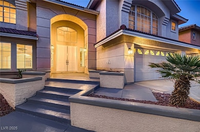 Property entrance with a tile roof, an attached ga