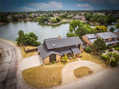 Large corner lake lot with circle drive