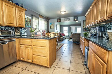 Kitchen featuring a peninsula, stainless steel dis