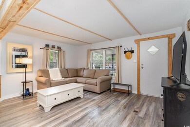 Living room featuring hardwood / wood-style floors