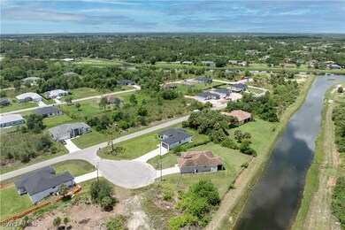 Aerial view of residential area with a large body