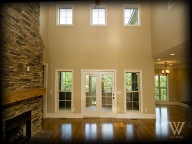Great room with floor to ceiling fireplace and wal