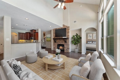 Open flowing floor plan seamlessly connecting the living room, breakfast area, and kitchen. The large breakfast bar offers a perfect spot for casual dining and gatherings. Virtually staged.
