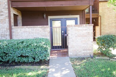 Entrance to property featuring brick siding