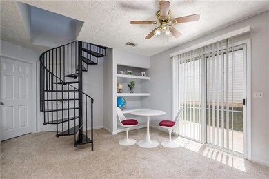 Dining space with carpet floors, a ceiling fan, a textured ceiling, stairs, and baseboards
