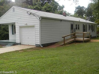 Exterior Front. Exterior Back, Freshly Pressure Washed and Deck Revitalized.