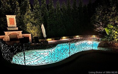 Private night time view of Gunite Self cleaning po