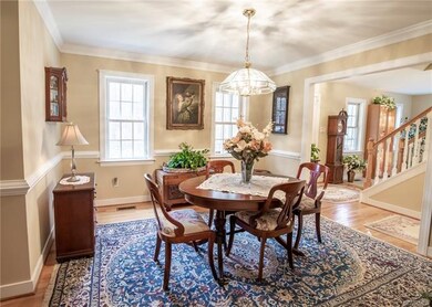 Dining Room with Hardwood Floors, Crown Moulding, 