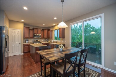 Eat in kitchen with stainless appliances.