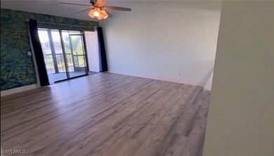 Unfurnished room with ceiling fan, baseboards, and