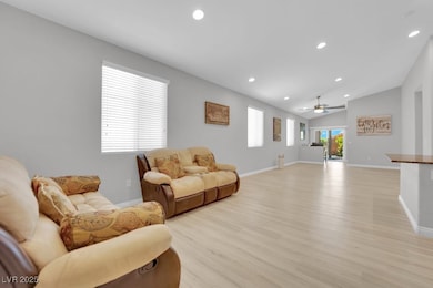 Living area with light wood-style flooring, ceilin