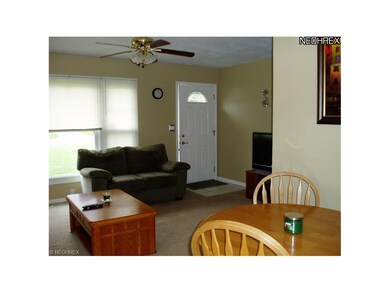 It also features a ceiling fan and opens to the ma