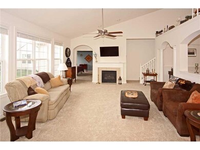 Living Room. The spacious living room features vaulted ceilings & lots of natural light!