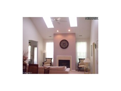 Warm and inviting great room with a two story fire