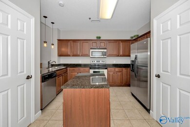 Tile flooring, pantry, kitchen island, granite countertops, stainless steel appliances, 9'ceilings