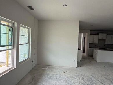 Unfurnished living room with healthy amount of nat