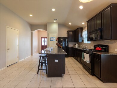 You will never run out of room in this kitchen! There is more than enough space to move around, cook and prepare meals, and store your kitchen items.