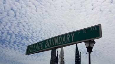 Street sign Village Boundary