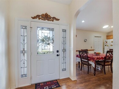 FOYER with laminate flooring and recess lighting.
