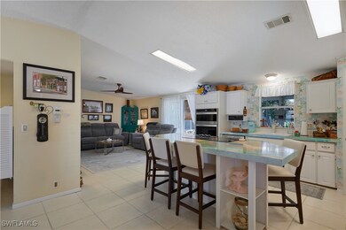 Kitchen with light tile patterned floors, visible