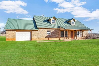 View of front facade featuring a front yard and a 