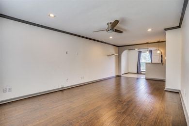 Empty room featuring hardwood / wood-style floorin