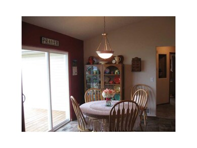 Kitchen. Dining area to deck.