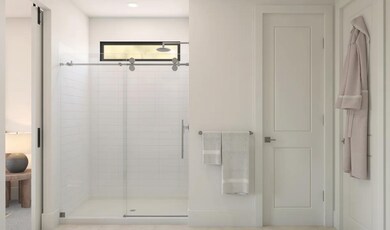 Primary bath with glass shower enclosure
