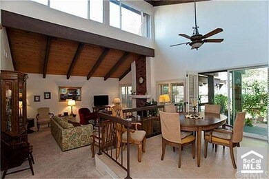 The eating and living areas with soaring ceilings