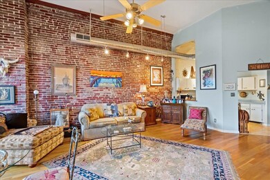 Living room with light hardwood / wood-style floor