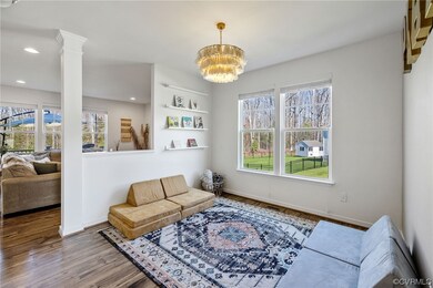 Dining room with  updated Anthropologie Chandelier