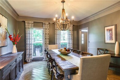 Dining room right of the entry foyer with wide pla