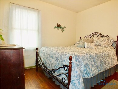 Master bedroom on the 1st floor with hardwood floo